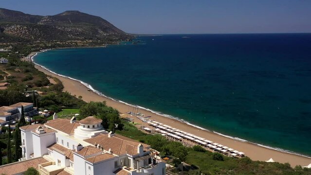 Limassol cyprus drone flying shot above beautiful hotel resort on the beach mountain view