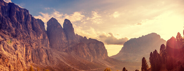 Mountain landscape. Rocks against the sky. The Dolomites in South Tyrol, Gardena Pass, Italy, Europe. Horizontal banner