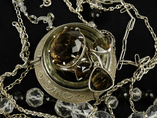 Silver rings with smoky topaz in a silver jewelry box and the vintage silver jewelries of various...