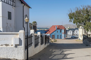 uphill street with picturesque old  buildings at historical town, Luderitz,  Namibia