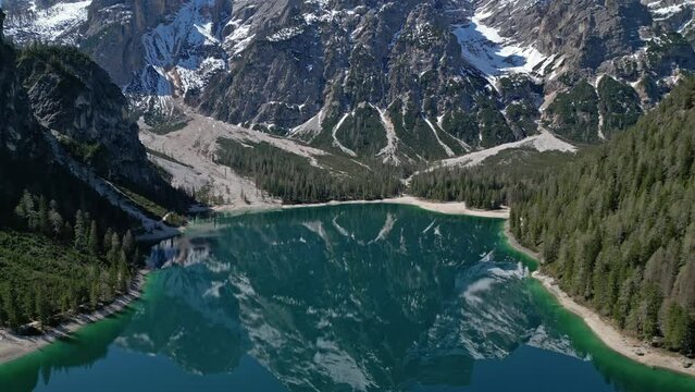Aerial view of mountain Lago di Braies - Lake Braies in Dolomite Alps, South Tyrol, Italy, 4k