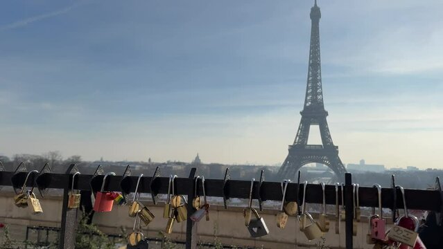 Paris, France, Eiffel Tower background, Valentine's day concept. Love locks attached to a bridge on the river Seine, Love symbols