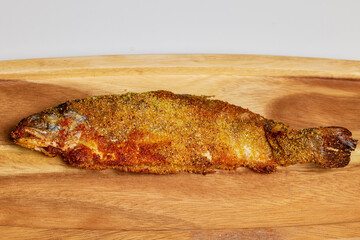 Trout prepared in the oven on a plate ready to be eaten.