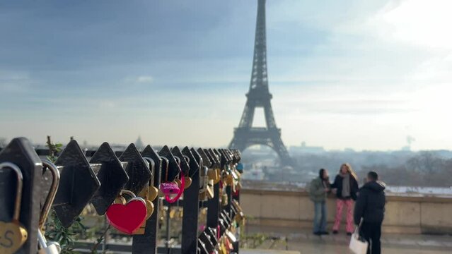 Paris, France, Eiffel Tower background, Valentine's day concept. Love locks attached to a bridge on the river Seine, Love symbols