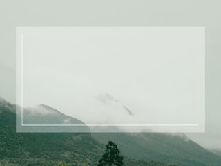 Copy space, white title banner on rainy season mountain background.