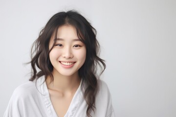 Asian girl with perfect skin and long, luxurious hair poses against a white backdrop, epitomizing beauty and simplicity. Generative AI.