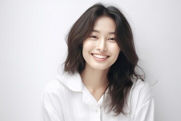 Asian girl with perfect skin and long, luxurious hair poses against a white backdrop, epitomizing beauty and simplicity. Generative AI.