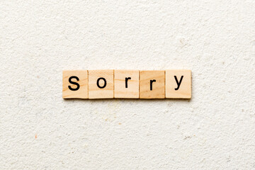 sorry word written on wood block. sorry text on table, concept