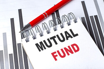 MUTUAL FUND text written on notebook with pen on chart