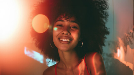 A beautiful African-American girl with a lush hairstyle is laughing