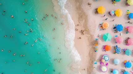 A vibrant beach scene from above, packed with people and a wide array of colorful umbrellas.