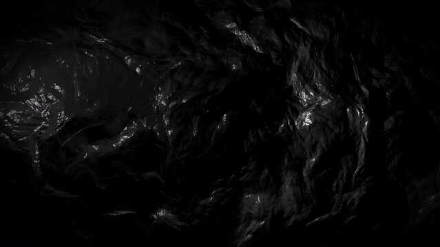 Abstract dark liquid waving background close-up.
