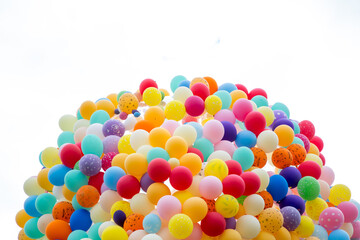 Balloons with colorful light effects creating a rainbow spectrum