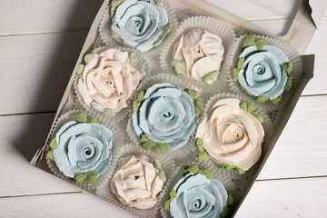 Marshmallows in open gift boxes. Zephyr fir cones and Zephyr flowers. Homemade Zephyr.