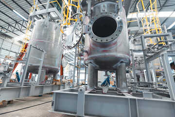 Stainless vertical steel tanks and pipes with pressure meter in equipment tank