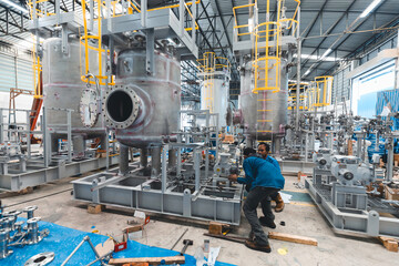 Stainless vertical steel tanks and pipes with pressure meter in equipment tank