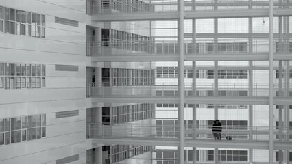 City Hall modern white architecture with people walking on elevated walkway