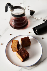 Sweet Breakfast concept. Blondies bars with v60 filter coffee, light background, airy mood food photo