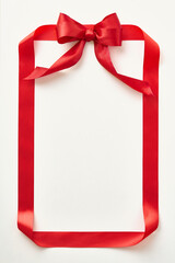 Red ribbon shaped like valentine card on light background. Top view. Copy space