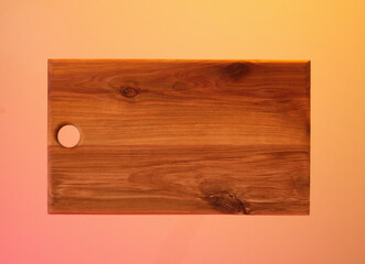 Wooden kitchen board for food preparation. Minimalist kitchen composition.