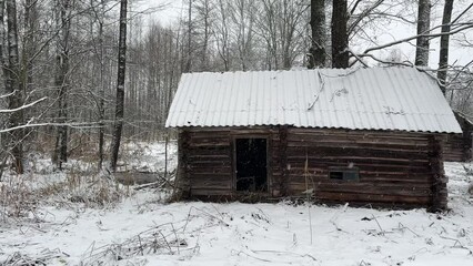 Abandoned house in village. Old wooden house in countryside in winter season. Winter in village. Old House in a snowy forest. Abandoned village with destroyed houses. Home ruin in countryside - Powered by Adobe