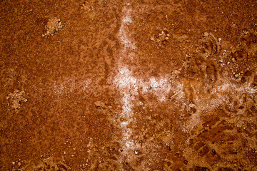 red clay baseball field and various views of the baseball home plate