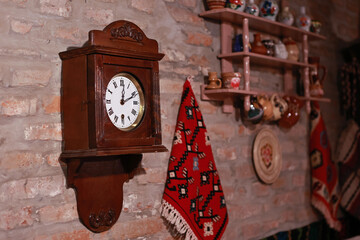 Wooden wall clock with pendulum.
