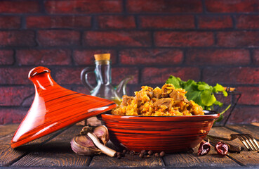 Tagine with traditional uzbek pilaf on a table