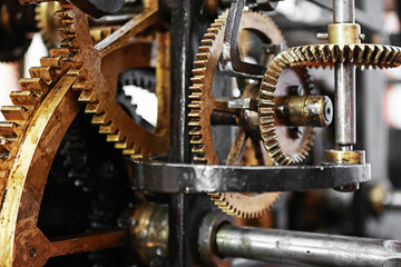 Clock mechanism in the tower. Metal wheels and rivets.