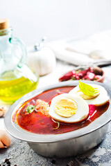 Traditional Ukrainian Russian borscht . Bowl of red beet root soup borsch with boiled egg - 720308618