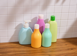 Colorful bottles of shower gels and shampoos. Bathroom accessories.
