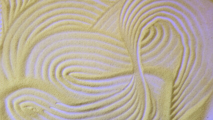 Fototapeta na wymiar Abstract semolina background with curved stripes