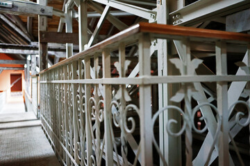 Beautifully ornate metal railing in the attic of the building.