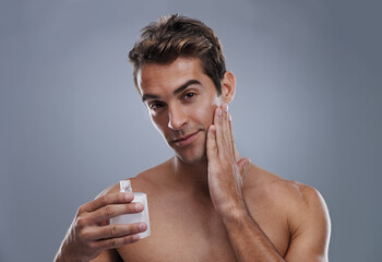 Portrait, cream and man with skincare, wellness and beauty with lotion and moisture with glow and...