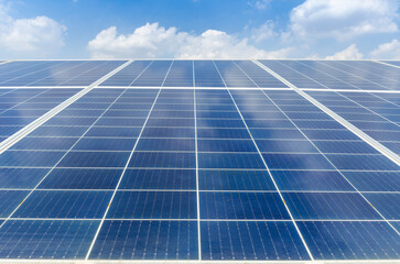 Solar panels and cloudy blue sky. Clean energy for the world, renewable energy