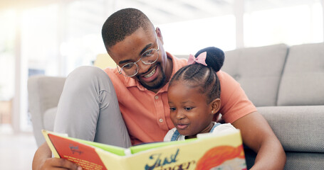 Reading, father and story with girl for learning in lounge for education or quality time. Kid, books and parent for support on floor or fun with growth for childhood at house with happy family.