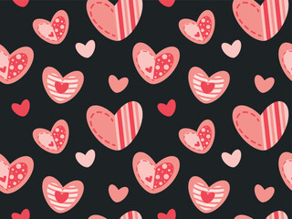 Seamless pattern with pink and red hearts on a black background. Cute romantic pink hearts for background, textile, wrapping paper.