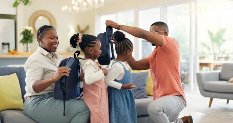 Obraz premium Morning, talking and a black family ready for school, preparation and helping with bags. Happy, care and children with help from an African mother and father for kindergarten in a home living room