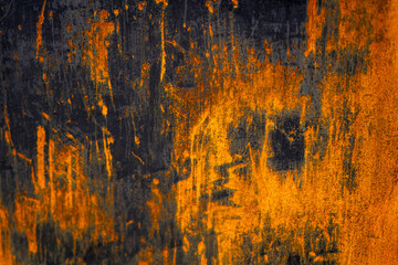 Rusty metal surface with black and orange details