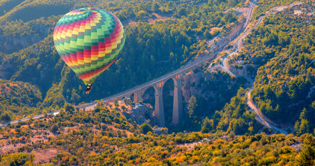 Hot air balloon flying over Varda Railway bridge