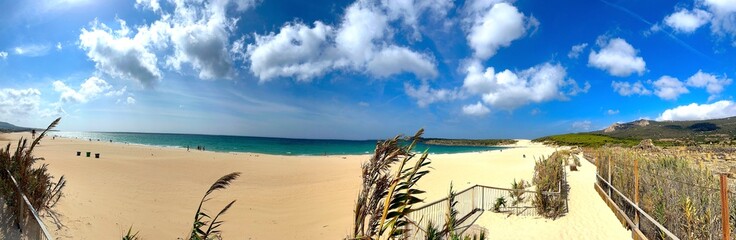panorama view from the promenade to the beautiful beach and dunes at the Playa de Bolonia at the Costa de la Luz, Andalusia, Cadiz, Spain