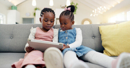 Black girl children, tablet on sofa and online with elearning or watching cartoon movie, sisters at...