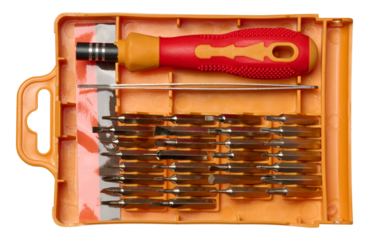 Plastic box with screwdriver and various bits for screws on isolated background