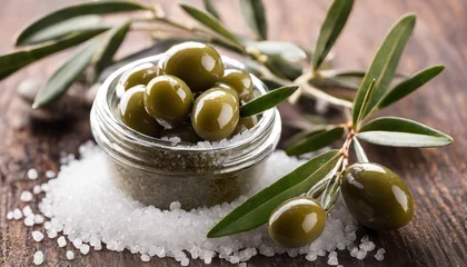 Foto op Plexiglas A jar of olives with leaves and salt © vivekFx