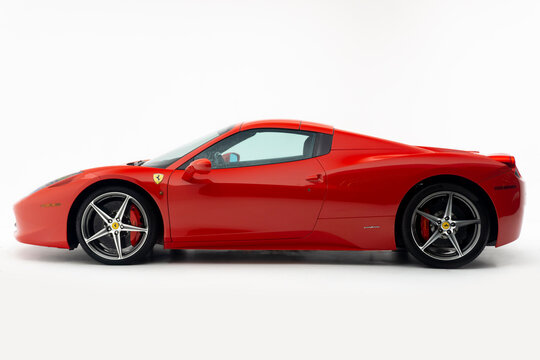 Side view of a red Ferrari 458 Spider - High Resolution Studio Image - Roof closed