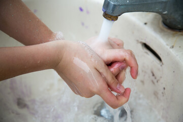Painting work: a painter washing hands after painting