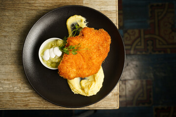 Schnitzel, Fried Chicken with Cucumber salad and mashed potato