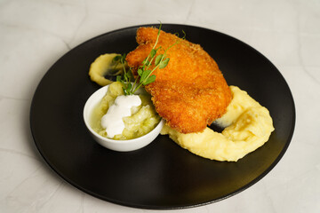 Schnitzel, Fried Chicken with Cucumber salad and mashed potato