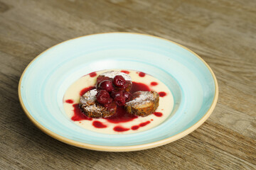 Poppy seeds bread pudding with cherry ragout and red wine