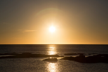 Fototapeta premium coastal scenery under the winter golden sunset.